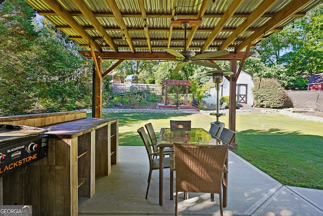 view of patio featuring a shed and ceiling fan