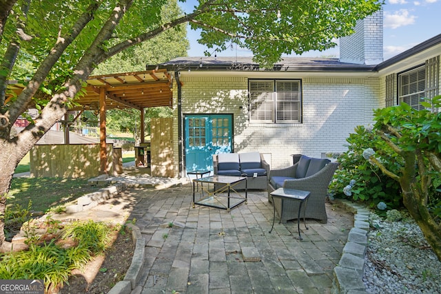 view of patio with outdoor lounge area and a pergola