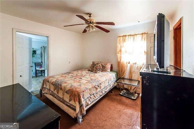 bedroom with ceiling fan and carpet flooring