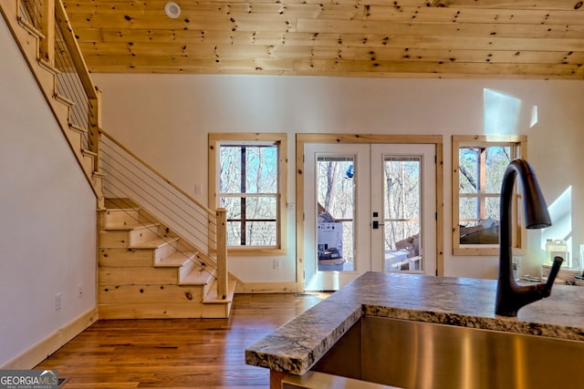 entrance foyer with hardwood / wood-style flooring, sink, french doors, and a wealth of natural light