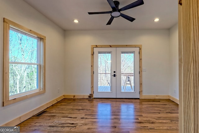 doorway with french doors, hardwood / wood-style flooring, and ceiling fan