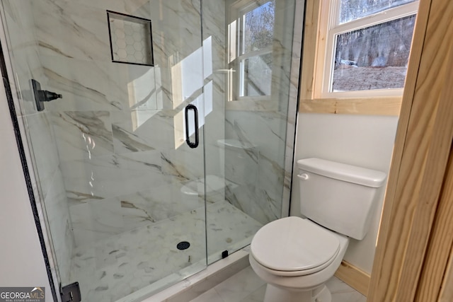 bathroom with toilet and an enclosed shower