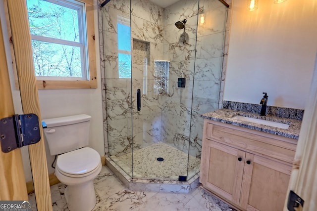 bathroom with vanity, toilet, and walk in shower