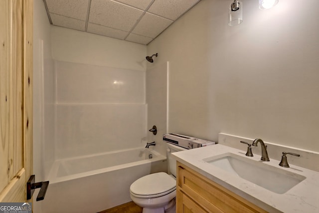 full bathroom featuring shower / bath combination, vanity, a paneled ceiling, and toilet