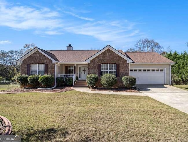 ranch-style house with a garage, covered porch, and a front yard