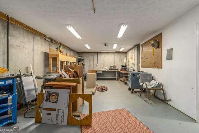 interior space with concrete flooring and a workshop area