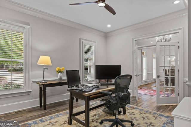 home office featuring dark hardwood / wood-style flooring, ceiling fan with notable chandelier, and ornamental molding