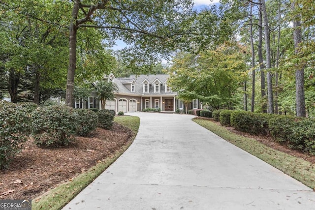 cape cod-style house featuring a garage