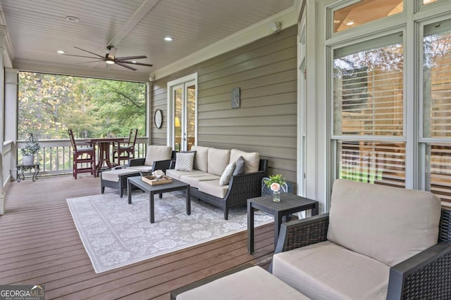 deck with an outdoor hangout area