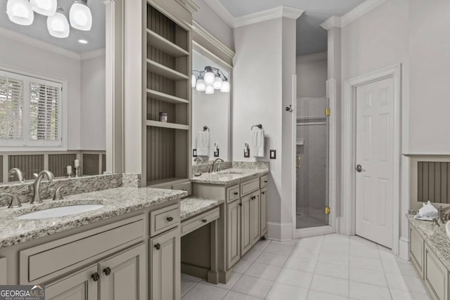 bathroom featuring vanity, crown molding, tile patterned floors, and a shower with door