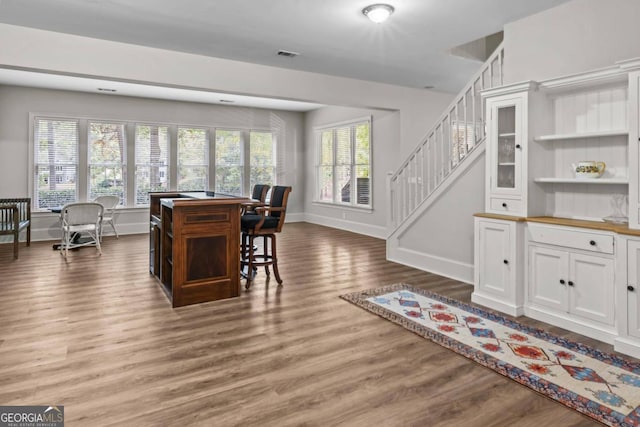 dining space featuring wood-type flooring