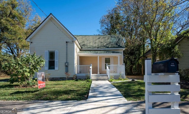 view of front of house featuring a front lawn and a porch