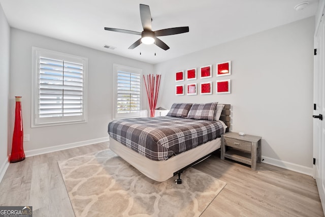 bedroom featuring ceiling fan and light hardwood / wood-style floors