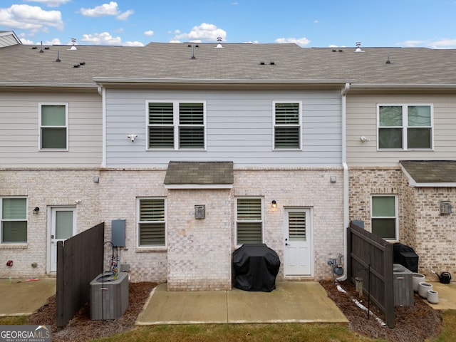 back of house featuring central AC and a patio