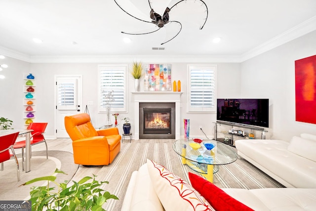 living room featuring hardwood / wood-style flooring and ornamental molding