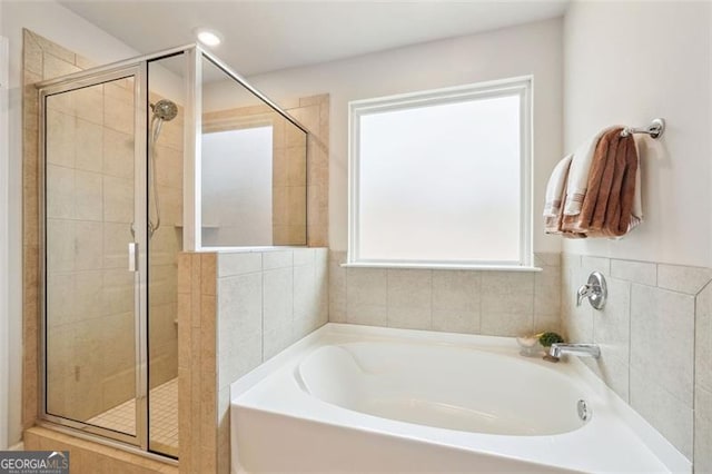 bathroom with independent shower and bath