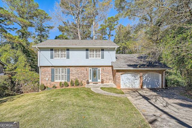 front of property featuring a front lawn and a garage