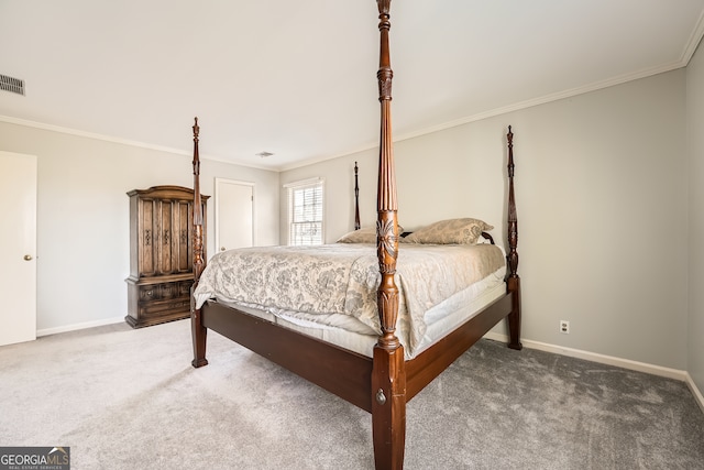 bedroom with ornamental molding and carpet