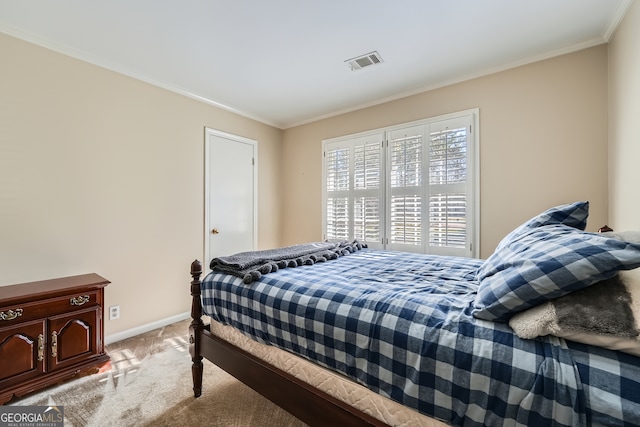 carpeted bedroom featuring crown molding