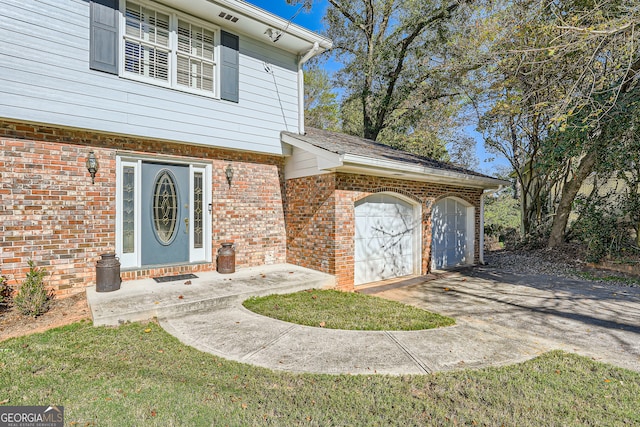 view of exterior entry featuring a garage