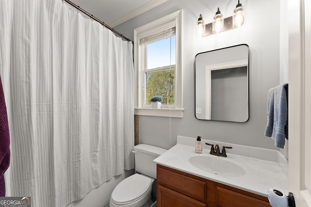 full bathroom featuring vanity, shower / bath combo, toilet, and crown molding