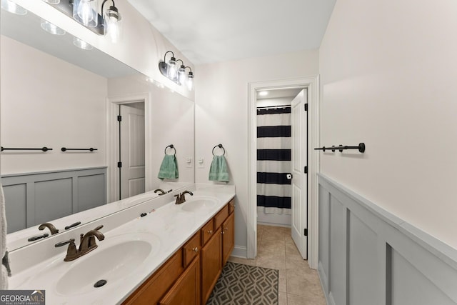 bathroom with tile patterned floors and vanity