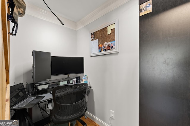 home office with wood-type flooring and ornamental molding