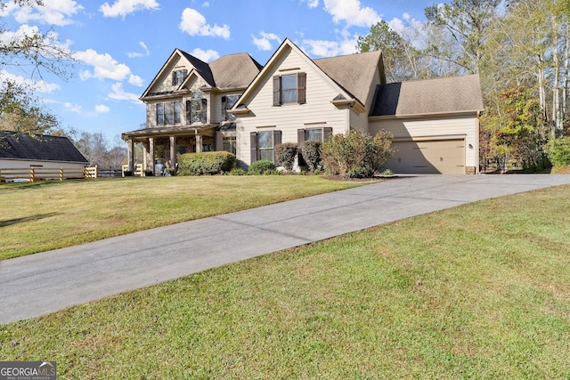 view of front of home featuring a garage and a front lawn