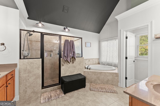 bathroom with tile patterned flooring, vanity, plus walk in shower, and lofted ceiling