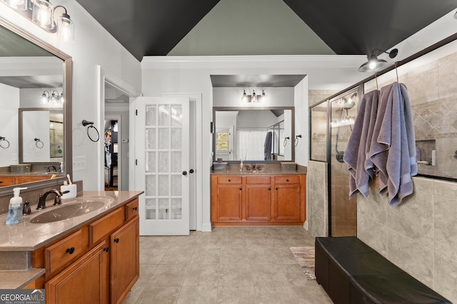 bathroom featuring tile patterned flooring, vanity, walk in shower, and tile walls