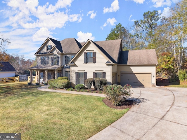 view of front facade featuring a front yard and a garage