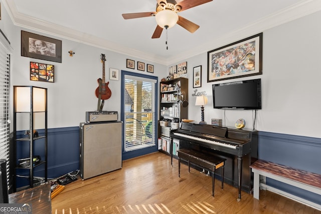 miscellaneous room featuring hardwood / wood-style floors, ceiling fan, and ornamental molding