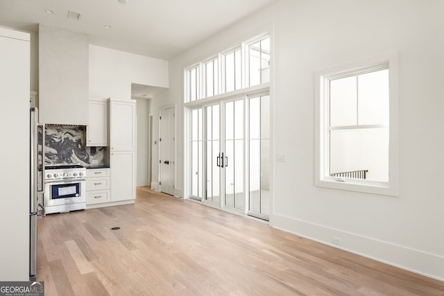 unfurnished living room featuring light hardwood / wood-style floors