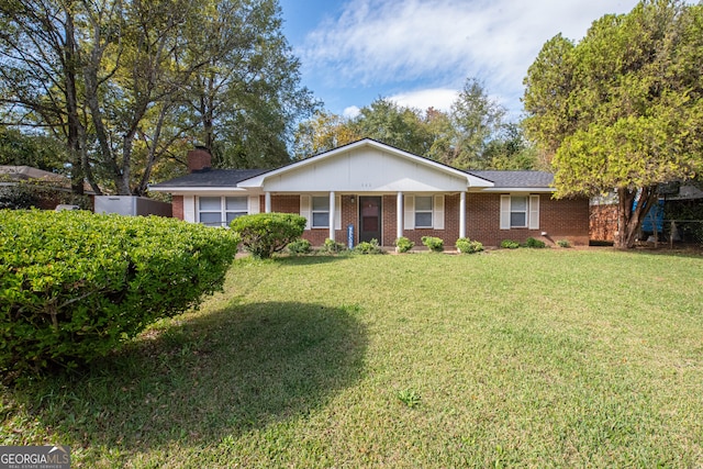 ranch-style home with a front yard