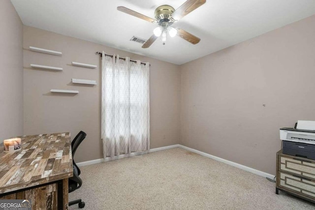 office space with light colored carpet and ceiling fan