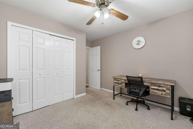 office area with ceiling fan and light colored carpet