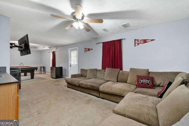 living room featuring light carpet, a textured ceiling, ceiling fan, and billiards