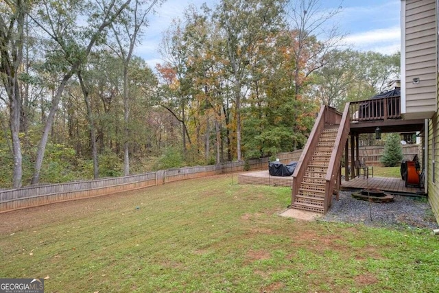 view of yard featuring a wooden deck