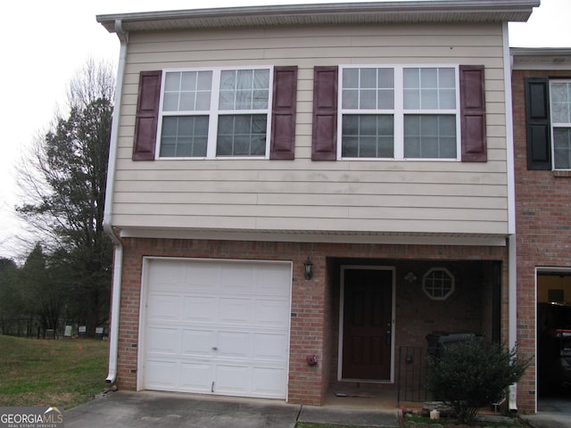 view of front of property with a garage