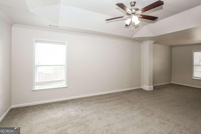 empty room featuring ceiling fan, carpet, and ornamental molding