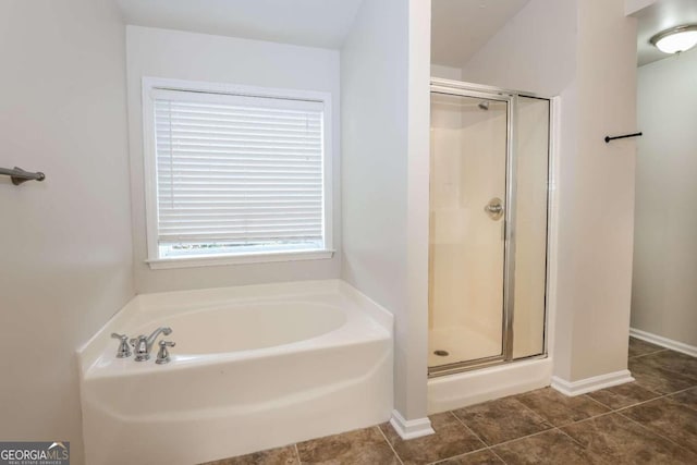 bathroom featuring tile patterned flooring and plus walk in shower