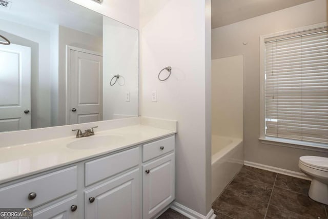 full bathroom with tile patterned floors, plus walk in shower, vanity, and toilet