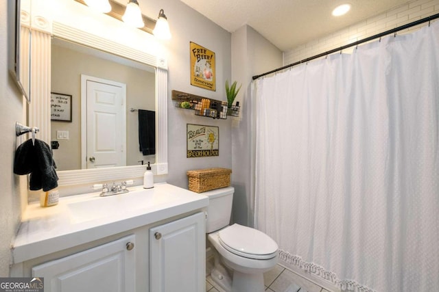 bathroom featuring tile patterned floors, walk in shower, vanity, and toilet