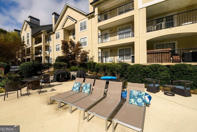 view of home's community with a patio area