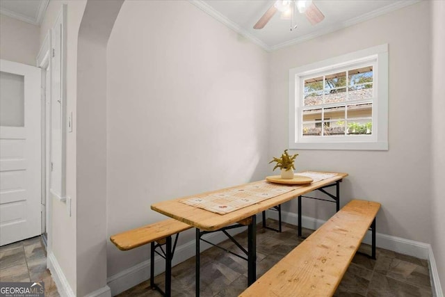 dining room featuring ornamental molding and ceiling fan