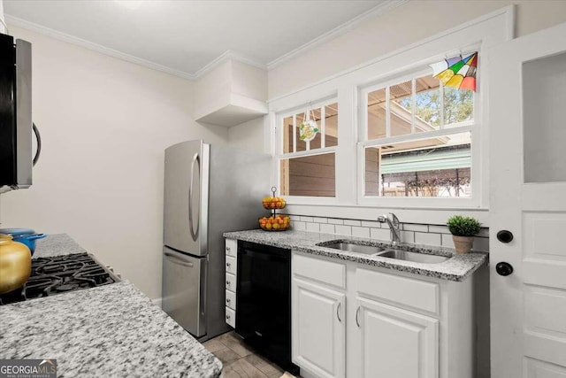 kitchen featuring light stone countertops, white cabinetry, dishwasher, sink, and crown molding