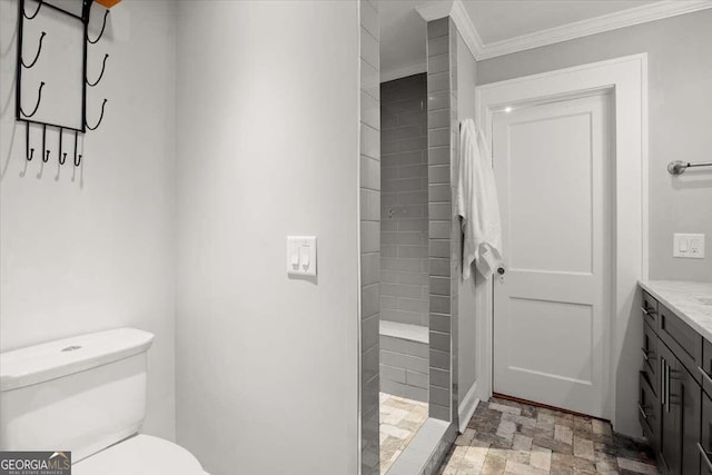 bathroom featuring vanity, toilet, walk in shower, and crown molding