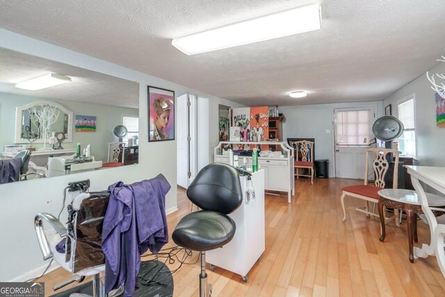 interior space featuring light hardwood / wood-style floors and a textured ceiling