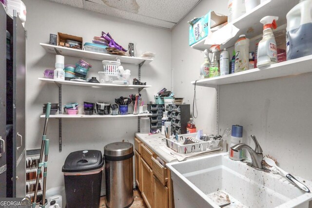 kitchen with a drop ceiling and sink