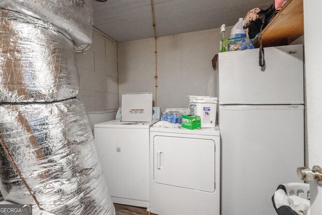 laundry area with washing machine and dryer